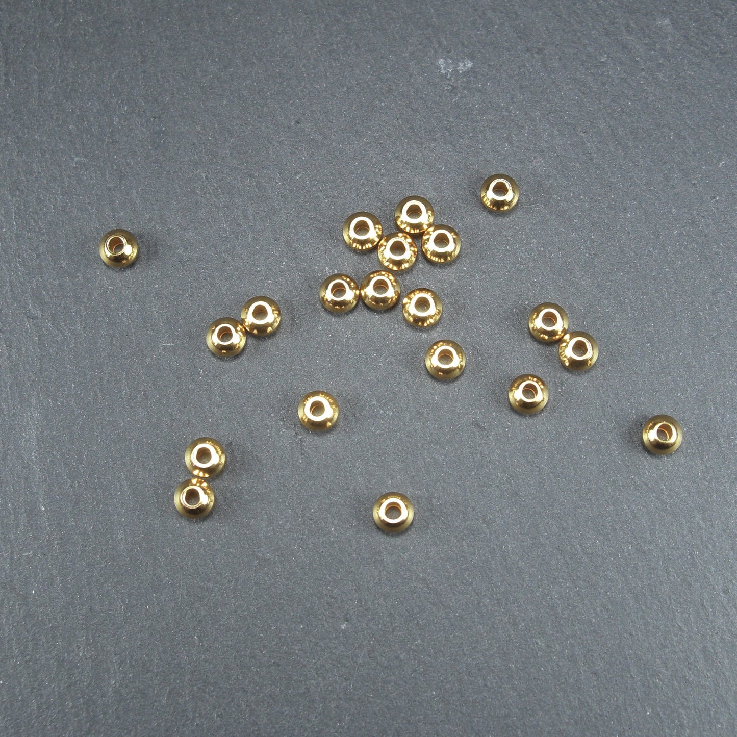 10 kleine Spacer Perlen, Rondell, schlicht, Edelstahl goldfarben, 10632