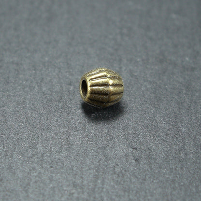 10 kleine Bicone Spacer Perlen 4,5 mm, geriffelt, antik bronzefarben, 10466