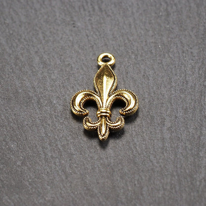 5 Anhänger Lilie, Fleur de Lis, antik goldfarben, 10940