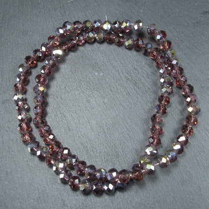 1 Strang Glas Perlen, Glas geschliffen, siena-violett, Kristall, 10493