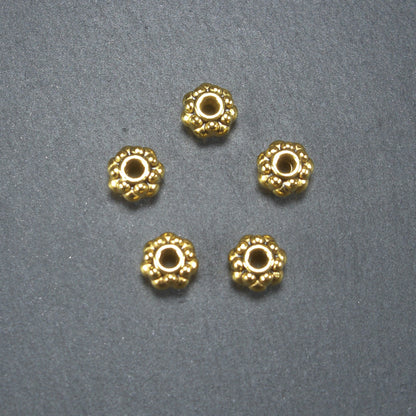 10 Spacer Perlen 7 mm, Blüten, goldfarben, 10465